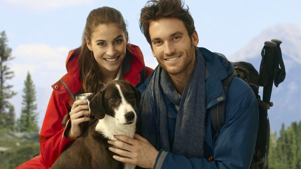 Trekkers with dog taking rest