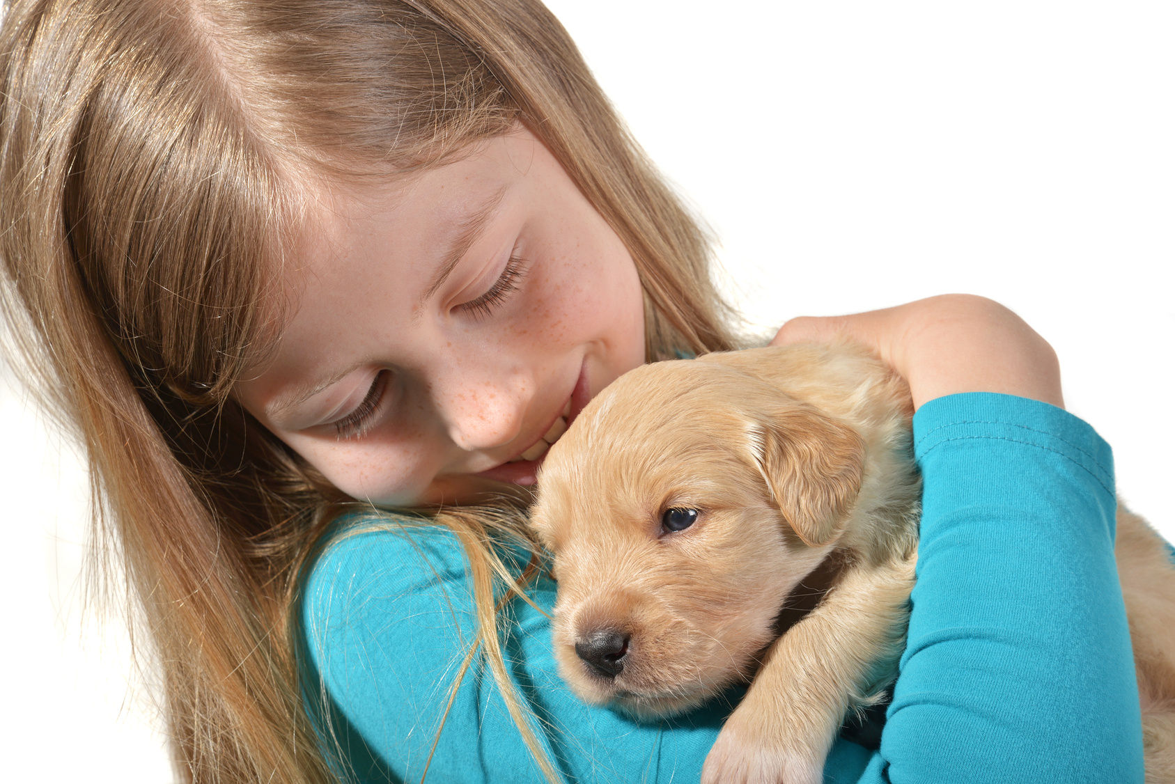 Girl holding a golden retriever pup