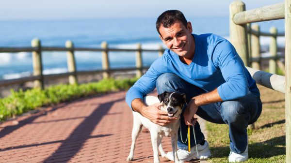 young man with his pet dog